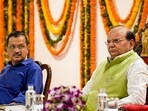 Delhi LG VK Saxena and Chief Minister Arvind Kejriwal attend a function in New Delhi. 