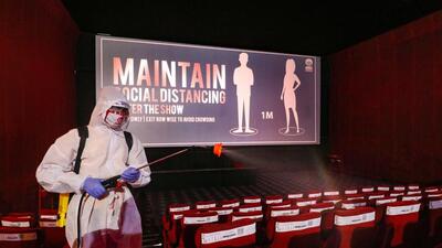 Ahmedabad: A worker wearing personal protective equipment (PPE) sprays disinfectant inside a cinema hall, as authorities allowed its re-opening with certain restrictions, during, Unlock-5 in Ahmedabad, Tuesday, Oct. 13, 2020. (PTI Photo) (PTI13-10-2020_000077A) (PTI) Ahmedabad: A worker wearing personal protective equipment (PPE) sprays disinfectant inside a cinema hall, as authorities allowed its re-opening with certain restrictions, during, Unlock-5 in Ahmedabad, Tuesday, Oct. 13, 2020. (PTI Photo) (PTI13-10-2020_000077A) (PTI)