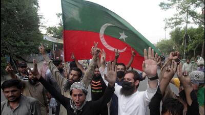 Supporters of Pakistan’s former prime minister Imran Khan celebrate, as according to Khan's lawyer the Supreme Court ruled that his arrest was illegal, outside of Khan's house, in Lahore, on Thursday. (REUTERS) Supporters of Pakistan’s former prime minister Imran Khan celebrate, as according to Khan's lawyer the Supreme Court ruled that his arrest was illegal, outside of Khan's house, in Lahore, on Thursday. (REUTERS)
