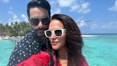 Neha Dhupia posed in front of blue waters in one of her photos with Angad Bedi. Neha Dhupia posed in front of blue waters in one of her photos with Angad Bedi.