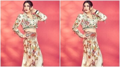 Raveena decked up in a white silk cropped shirt with multicoloured patterns throughout and white and green embellishment at the borders. She further teamed it with a matching long skirt with gathered details at the waist. (Instagram/@officialraveenatandon) Raveena decked up in a white silk cropped shirt with multicoloured patterns throughout and white and green embellishment at the borders. She further teamed it with a matching long skirt with gathered details at the waist. (Instagram/@officialraveenatandon)