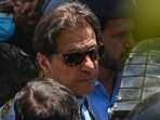 Policemen escort Pakistan's former Prime Minister Imran Khan (C) as he arrives at the high court in Islamabad on Friday. Policemen escort Pakistan's former Prime Minister Imran Khan (C) as he arrives at the high court in Islamabad on Friday.