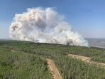 In this photo provided by the Government of Alberta Fire Service, a wildfire burns a section of forest in the Grande Prairie district of Alberta, Canada. (AP)