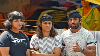 New Delhi, May 11 (ANI): Wrestlers Bajrang Punia, Sakshi Mallik and Vinesh Phogat wearing black ribbons marking 'Black Day' during their ongoing protest against the alleged sexual harassment of players by WFI chief Brij Bhushan Sharan Singh, at Jantar Mantar in New Delhi on Thursday. (ANI Photo) (Ishant) New Delhi, May 11 (ANI): Wrestlers Bajrang Punia, Sakshi Mallik and Vinesh Phogat wearing black ribbons marking 'Black Day' during their ongoing protest against the alleged sexual harassment of players by WFI chief Brij Bhushan Sharan Singh, at Jantar Mantar in New Delhi on Thursday. (ANI Photo) (Ishant)