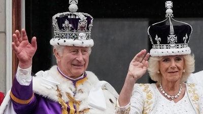 Britain's King Charles III and Queen Camilla wave to the crowds from the balcony of Buckingham Palace. (AP) Britain's King Charles III and Queen Camilla wave to the crowds from the balcony of Buckingham Palace. (AP)