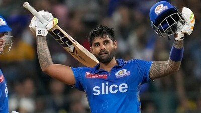 Mumbai Indians' Suryakumar Yadav, right, celebrates his century during the Indian Premier League cricket match between Mumbai Indians and Gujrat Titans in Mumbai, India, Friday, May 12, 2023. (AP Photo /Rajanish Kakade) (AP) Mumbai Indians' Suryakumar Yadav, right, celebrates his century during the Indian Premier League cricket match between Mumbai Indians and Gujrat Titans in Mumbai, India, Friday, May 12, 2023. (AP Photo /Rajanish Kakade) (AP)