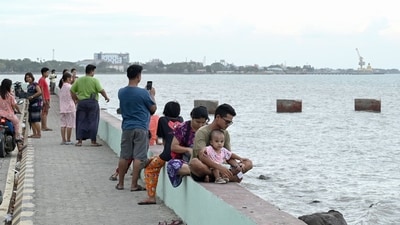 People gather by the seafront in Sittwe in Myanmar�s Rakhine state on May 12, 2023, ahead of the expected arrival of Cyclone Mocha. (AFP) People gather by the seafront in Sittwe in Myanmar�s Rakhine state on May 12, 2023, ahead of the expected arrival of Cyclone Mocha. (AFP)