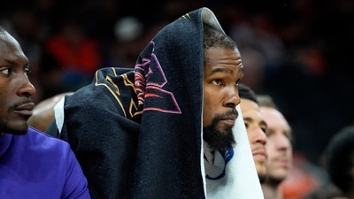 Phoenix Suns forward Kevin Durant watches from the bench during the second half of Game 6 of an NBA basketball Western Conference semifinal series against the Denver Nuggets, (AP) Phoenix Suns forward Kevin Durant watches from the bench during the second half of Game 6 of an NBA basketball Western Conference semifinal series against the Denver Nuggets, (AP)