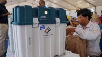 Polling officials collect VVPATs and other voting materials ahead of the Karnataka assembly elections, at Veterinary College distribution centre in Bengaluru on Tuesday. (PTI) Polling officials collect VVPATs and other voting materials ahead of the Karnataka assembly elections, at Veterinary College distribution centre in Bengaluru on Tuesday. (PTI)