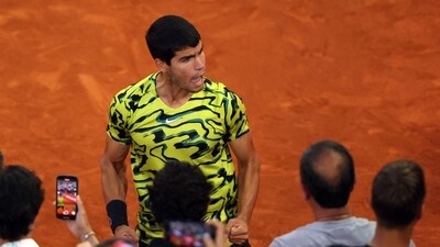 Spain's Carlos Alcaraz celebrates after winning the 2023 ATP Tour Madrid Open tennis tournament singles final match against Germany's Jan-Lennard Struff at Caja Magica in Madrid. (AFP) Spain's Carlos Alcaraz celebrates after winning the 2023 ATP Tour Madrid Open tennis tournament singles final match against Germany's Jan-Lennard Struff at Caja Magica in Madrid. (AFP)