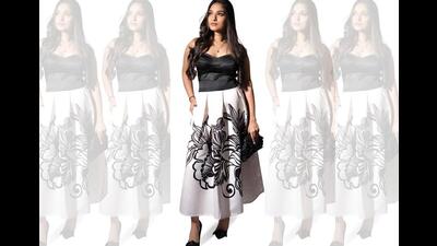 Tasheen Rahimtoola pairs a statement skirt and heels with a crisp blouse for a feminine look that also reflects a strong personality. Tasheen Rahimtoola pairs a statement skirt and heels with a crisp blouse for a feminine look that also reflects a strong personality.