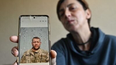 Ukrainian servicewoman Svitlana Povar shows on her mobile phone a photograph of her late husband, Ukrainian soldier Semen Povar. (AFP) Ukrainian servicewoman Svitlana Povar shows on her mobile phone a photograph of her late husband, Ukrainian soldier Semen Povar. (AFP)