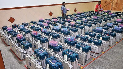 Workers arrange EVMs in a strong room after the Karnataka assembly elections, in Bengaluru. (PTI) Workers arrange EVMs in a strong room after the Karnataka assembly elections, in Bengaluru. (PTI)