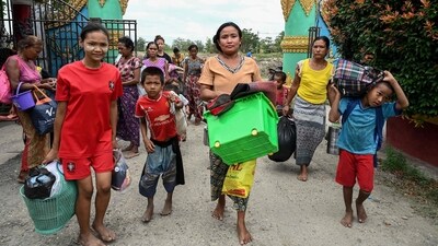 People arrive to take shelter at a monastery in Sittwe town in Myanmar�s Rakhine state on Friday. (AFP) People arrive to take shelter at a monastery in Sittwe town in Myanmar�s Rakhine state on Friday. (AFP)