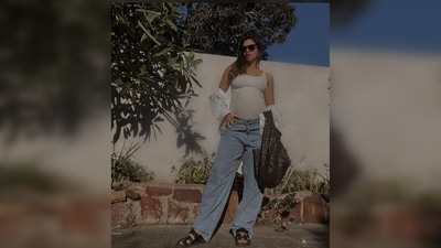 Gabriella Demetriades kept it comfy yet stylish in an off-white tank top, oversized white shirt and low waist wide-leg denim. (Instagram/@gabriellademetriades) Gabriella Demetriades kept it comfy yet stylish in an off-white tank top, oversized white shirt and low waist wide-leg denim. (Instagram/@gabriellademetriades)