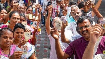 Bengaluru: People wait in queues at a polling station to cast their votes for Karnataka Assembly elections, in Bengaluru, Wednesday, May 10, 2023. (PTI) Bengaluru: People wait in queues at a polling station to cast their votes for Karnataka Assembly elections, in Bengaluru, Wednesday, May 10, 2023. (PTI)