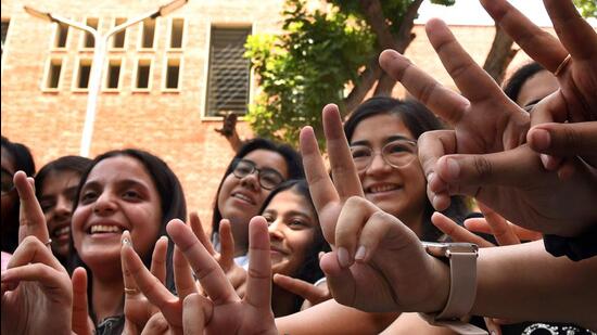 Students celebrate after CBSE results on Friday. (HT Photo)