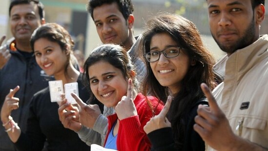 Karnataka election results 2023: Young voters showing their inked fingers after casting their votes. Karnataka election results 2023: Young voters showing their inked fingers after casting their votes.