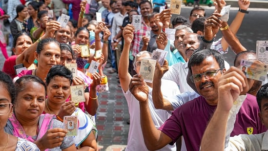 Bengaluru: People wait in queues at a polling station to cast their votes for Karnataka Assembly elections, Karnataka. Bengaluru: People wait in queues at a polling station to cast their votes for Karnataka Assembly elections, Karnataka.