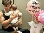 Karan Singh Grover holds daughter Devi close in new photos. 