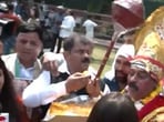 Congress leaders were seen distributing and eating laddoos. A Congress leader was also seen dressed as lord Hanuman outside the party's Delhi office. (Twitter/ANI)
