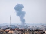 Smoke rises above buildings in Gaza city following an Israeli air strike.