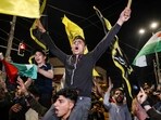 Palestinians and supporters of the Islamic Jihad militant group celebrate in the street after Palestenian factions and Israel reached a ceasefire agreement in Gaza City. Palestinians and supporters of the Islamic Jihad militant group celebrate in the street after Palestenian factions and Israel reached a ceasefire agreement in Gaza City.