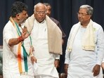 Bengaluru: Congress President Mallikarjun Kharge with former Karnataka CM Siddaramaiah and Karnataka Congress President D.K. Shivakumar during celebrations after the party's win in Karnataka Assembly elections, in Bengaluru, Saturday, May 13, 2023. (PTI Photo/Shailendra Bhojak)(PTI05_13_2023_000419B)(PTI)