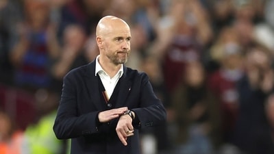 Manchester United's head coach Erik ten Hag walks in his coaching zone (AP)