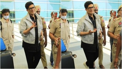 Manish wore a long black button-down shirt featuring a collared neckline and front button closures. He teamed it with matching skinny-fit pants, white loafers, nerdy glasses, and a light blue-coloured denim jacket from Louis Vuitton. (HT Photo/Varinder Chawla) Manish wore a long black button-down shirt featuring a collared neckline and front button closures. He teamed it with matching skinny-fit pants, white loafers, nerdy glasses, and a light blue-coloured denim jacket from Louis Vuitton. (HT Photo/Varinder Chawla)