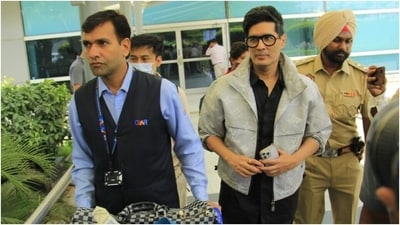 Meanwhile, Manish Malhotra, who has reportedly dressed Parineeti and Raghav for their wedding and other ceremonies, opted for a denim jacket and a coordinated shirt pant set for his airport look. (HT Photo/Varinder Chawla) Meanwhile, Manish Malhotra, who has reportedly dressed Parineeti and Raghav for their wedding and other ceremonies, opted for a denim jacket and a coordinated shirt pant set for his airport look. (HT Photo/Varinder Chawla)