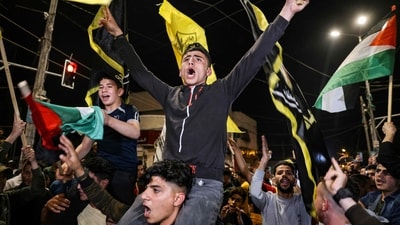 Palestinians and supporters of the Islamic Jihad militant group celebrate in the street after Palestenian factions and Israel reached a ceasefire agreement in Gaza City. (AFP) Palestinians and supporters of the Islamic Jihad militant group celebrate in the street after Palestenian factions and Israel reached a ceasefire agreement in Gaza City. (AFP)
