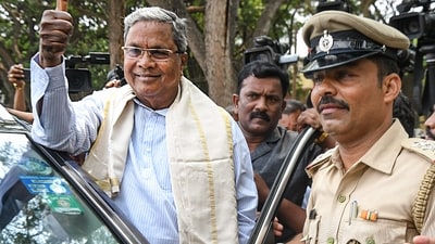 Congress leader Siddaramaiah reacts as the party leads in Karnataka Assembly polls on the vote counting day, in Mysuru. (PTI) Congress leader Siddaramaiah reacts as the party leads in Karnataka Assembly polls on the vote counting day, in Mysuru. (PTI)