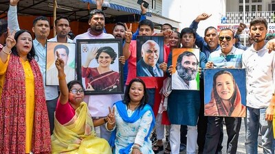 Congress leaders and supporters celebrate the party's good show in Karnataka Assembly polls at the Rajiv Bhawan in Guwahati. (PTI) Congress leaders and supporters celebrate the party's good show in Karnataka Assembly polls at the Rajiv Bhawan in Guwahati. (PTI)