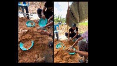 People wash plates with mud. (Twitter/@IniAlalalannn) People wash plates with mud. (Twitter/@IniAlalalannn)