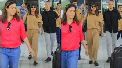 Priyanka styled the beige ensemble with a black shoulder tote bag, matching mules, a baseball cap, and tinted sunglasses. Lastly, open tresses, nude pink lips, and minimal makeup gave the finishing touch to her airport look. (HT Photo/Varinder Chawla) Priyanka styled the beige ensemble with a black shoulder tote bag, matching mules, a baseball cap, and tinted sunglasses. Lastly, open tresses, nude pink lips, and minimal makeup gave the finishing touch to her airport look. (HT Photo/Varinder Chawla)