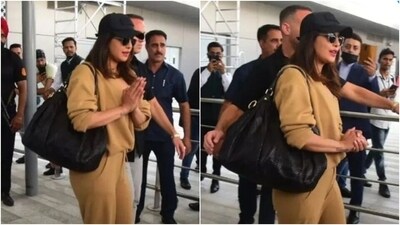 Priyanka arrived in Delhi from London to attend her cousin sister, Parineeti Chopra's engagement ceremony. Priyanka chose a comfy beige-coloured ensemble - featuring a baggy shirt and jogger pants - for her travels. Priyanka arrived in Delhi from London to attend her cousin sister, Parineeti Chopra's engagement ceremony. Priyanka chose a comfy beige-coloured ensemble - featuring a baggy shirt and jogger pants - for her travels. 