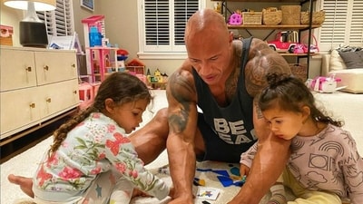 Dwayne Johnson with his daughters during their playtime. Dwayne Johnson with his daughters during their playtime.