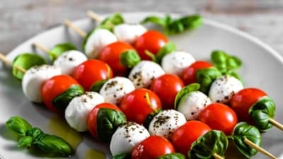 Caprese Salad Skewers: Alternate cherry tomatoes, mini mozzarella balls (bocconcini), and fresh basil leaves on skewers. Drizzle with balsamic reduction or olive oil for a light and delicious snack. (Pinterest) Caprese Salad Skewers: Alternate cherry tomatoes, mini mozzarella balls (bocconcini), and fresh basil leaves on skewers. Drizzle with balsamic reduction or olive oil for a light and delicious snack. (Pinterest)