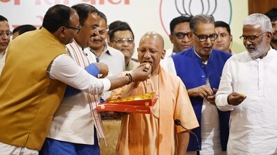 Uttar Pradesh chief minister Yogi Adityanath along with deputy CM Keshav Prasad Maurya and Brajesh Pathak and others during the press conference on BJP massive victory in Local bodies election on Saturday. (Deepak Gupta/HT Photo)