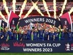Chelsea players celebrate with the trophy after winning the Women's FA Cup