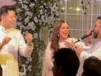 Mika singing on stage and posing with Arvind Kejriwal and Bhagwant Mann at Parineeti Chopra and Raghav Chadha's engagement. 