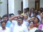 DK Shivakumar's supporters raise slogans outside his residence in Bengaluru.