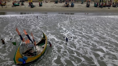 Cyclone Mocha: A drone view shows fishermen portaging their boats to safer ground due to Cyclone Mocha, in Teknaf Marine Drive, Cox's Bazar, Bangladesh. (Reuters)