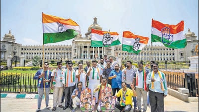 Bengaluru: Congress workers celebrate the party's win in Karnataka Assembly elections, outside Vidhana Soudha in Bengaluru, Sunday, May 14, 2023. (PTI Photo/Shailendra Bhojak)(PTI05_14_2023_000098B) (PTI) Bengaluru: Congress workers celebrate the party's win in Karnataka Assembly elections, outside Vidhana Soudha in Bengaluru, Sunday, May 14, 2023. (PTI Photo/Shailendra Bhojak)(PTI05_14_2023_000098B) (PTI)