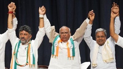 Congress president Mallikarjun Kharge with former Karnataka CM Siddaramaiah and Karnataka Congress President DK Shivakumar during celebrations after the party's win in the Karnataka assembly elections, in Bengaluru on Saturday. (PTI) (HT_PRINT) Congress president Mallikarjun Kharge with former Karnataka CM Siddaramaiah and Karnataka Congress President DK Shivakumar during celebrations after the party's win in the Karnataka assembly elections, in Bengaluru on Saturday. (PTI) (HT_PRINT)