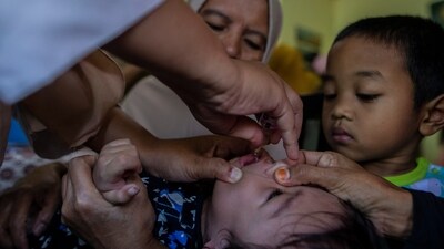 A health worker gives a polio vaccine to a child at a Healthcare Center in Bogor, West Java. (AFP) A health worker gives a polio vaccine to a child at a Healthcare Center in Bogor, West Java. (AFP)