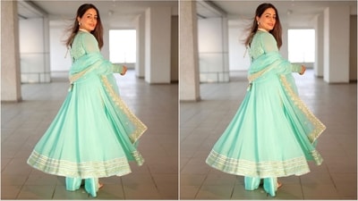 Hina Khan's cyan blue anarkali kurta was embellished with intricate Gota, Mirror, and Thread embroidery, accentuating the deep V-neckline. The kurta also featured Kalis down the waistline, adding a graceful flow to the ensemble. She paired the kurta with matching pants and a dupatta, completing the stunning ethnic look. (Instagram/@realhinakhan) Hina Khan's cyan blue anarkali kurta was embellished with intricate Gota, Mirror, and Thread embroidery, accentuating the deep V-neckline. The kurta also featured Kalis down the waistline, adding a graceful flow to the ensemble. She paired the kurta with matching pants and a dupatta, completing the stunning ethnic look. (Instagram/@realhinakhan)