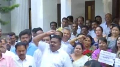 DK Shivakumar's supporters raise slogans outside his residence in Bengaluru. (Twitter/ANI)