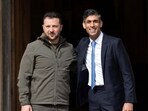 Britain's Prime Minister, Rishi Sunak, right, greets Ukraine's President, Volodymyr Zelenskyy, after his arrival in England. 
